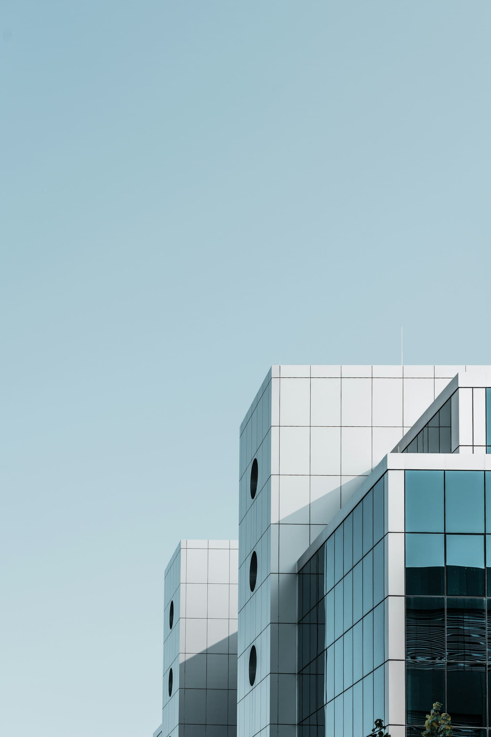 Illustrative modern commercial building exterior showing architectural facades and glazing